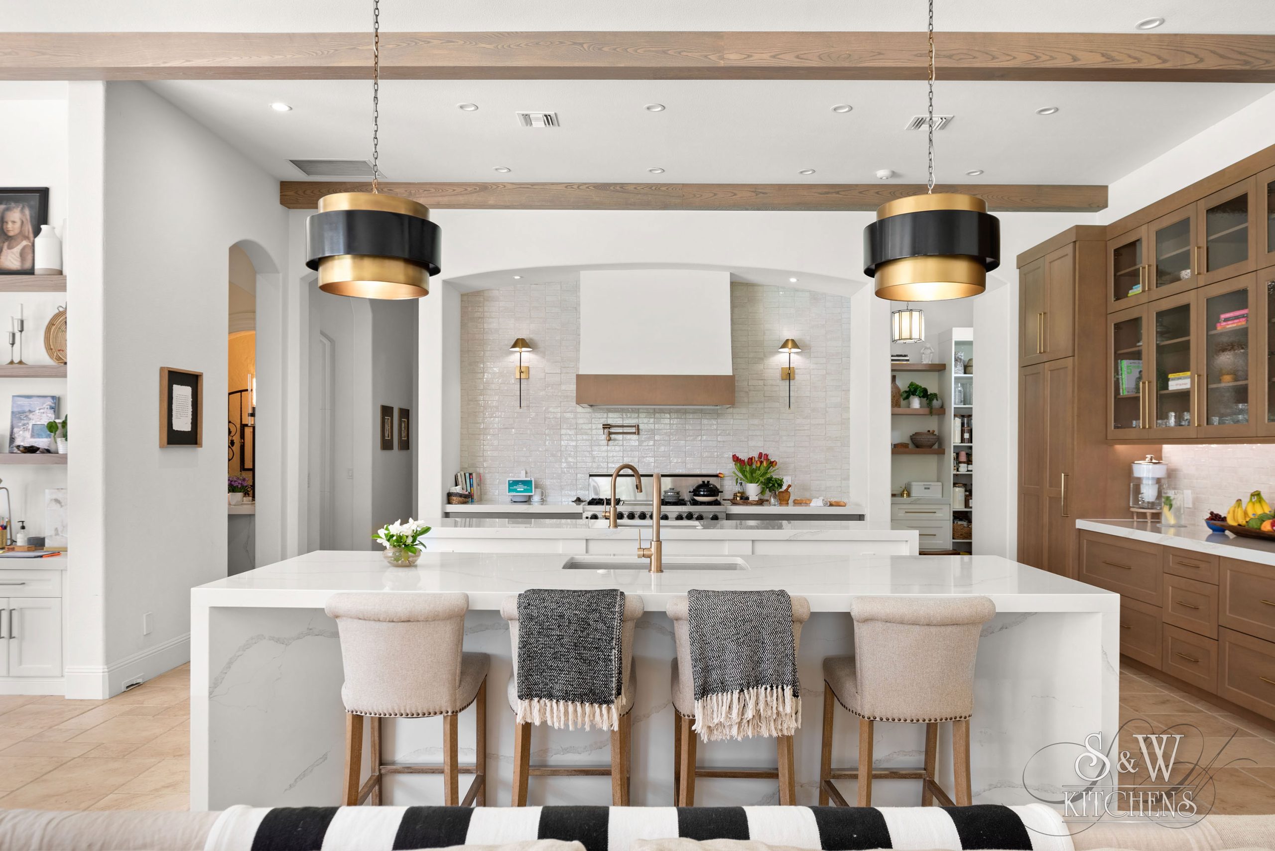 luxury kitchen featuring a double kitchen island and butlers pantry in winter park, fl 