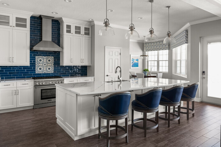 kitchen with blue backsplash and blue island seating