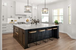 all white kitchen with black island caitlin-drive