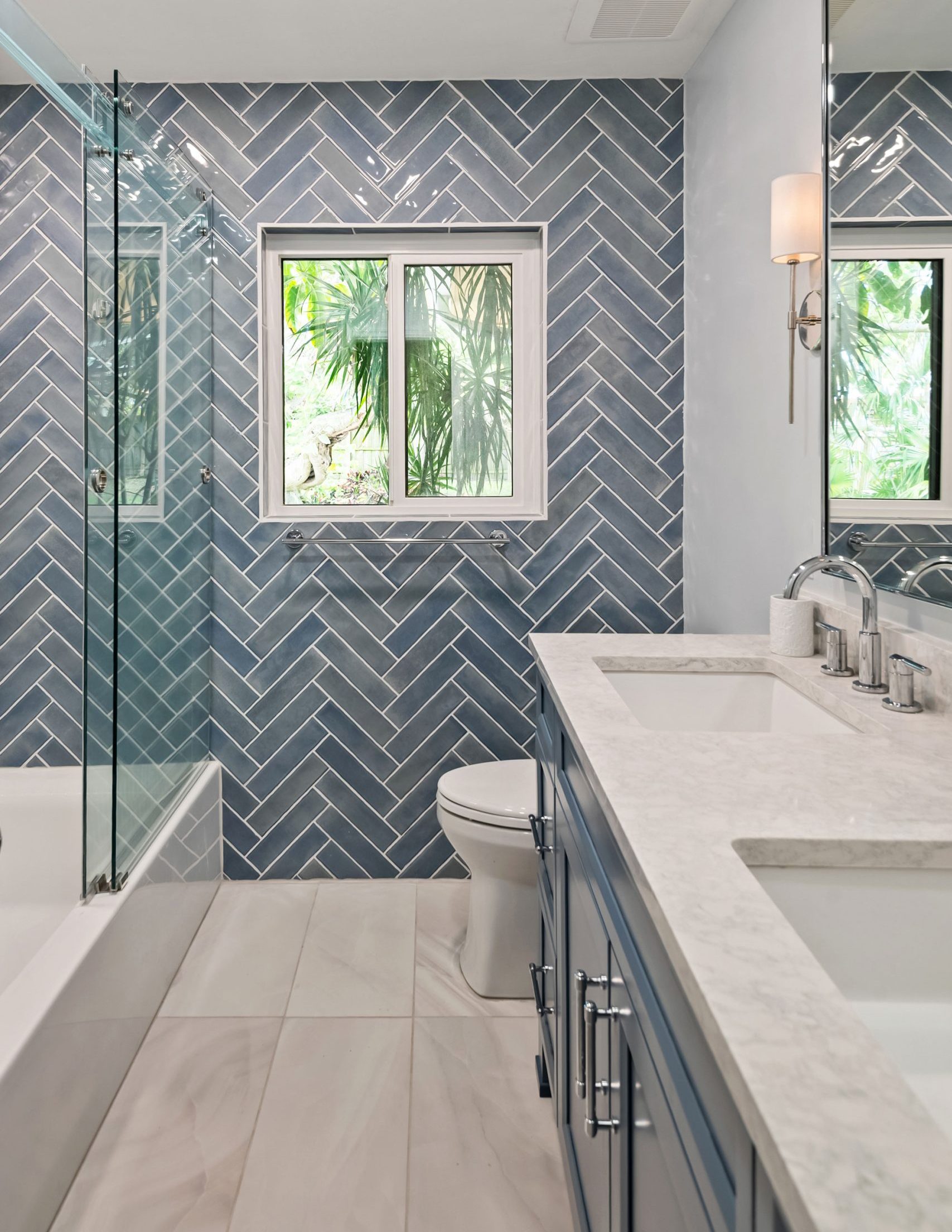 S&W Kitchens Tampa bathroom remodel herringbone blue tile accent wall
