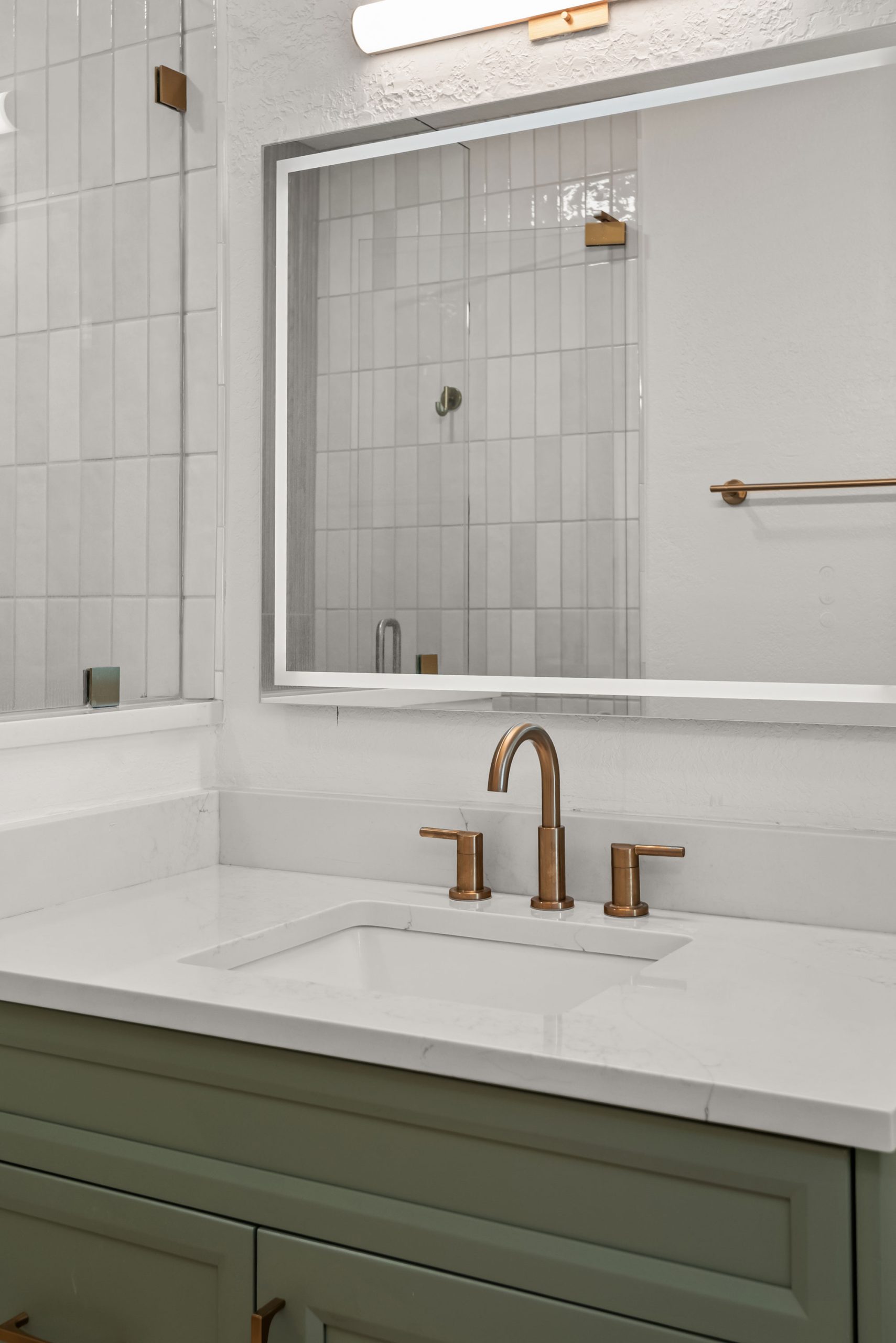 Gulf Way Tampa bath remodel brass faucet white countertops