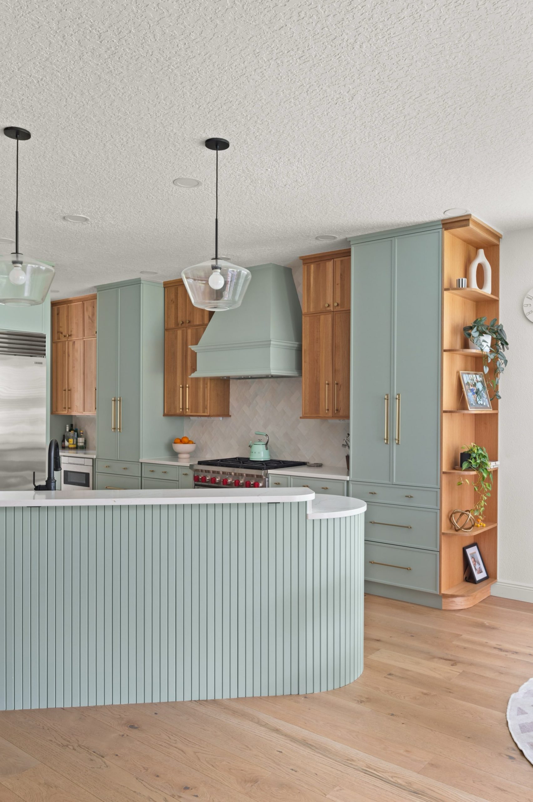 Amelia Pond Drive Two toned warm natural wood and soft blue-green cabinetry kitchen remodel